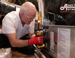 Technician servicing a residential furnace